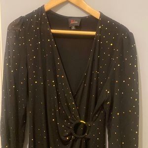 It's JM studio black dress with polkadots and gold very chic